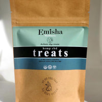 This pictures the small size, (10 ct.) of Emisha CBD Dog Chews. The soft chews are visible and deliver 2.5 mg per chew for your dog. A tasty and functional morsel helping your dog's reduce inflammation, ease anxieties and even support arthritic conditions. The package is also lovely. A kraft bag with colors inspired by the Founder's travels through Morocco with a logo designed with beloved dogs, Zeus&Caesar 